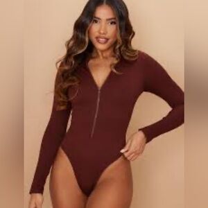 NWT- NAKED WARDROBE Snatched Zip me up Long sleeves ribbed bodysuits.